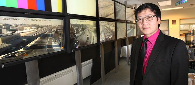 Yeatland Wong, senior engineer for intelligent transportation systems with the City of Calgary, at the traffic management centre along Spiller Road S.E. Photo by Wil Andruschak/For CREB®Now